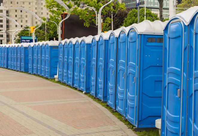 a line of portable restrooms at a sporting event, providing athletes and spectators with clean and accessible facilities in Charleston